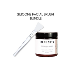 Silicone facial brush and jar of CLN & DIRTY mask on a white background