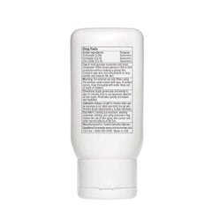 White sunscreen bottle with label on a white background