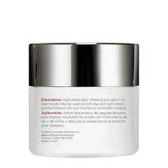 Skincare jar with silver lid and white body on a white background