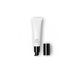 White cosmetic tube with black cap on a white background