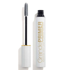 Mascara with a white tube and black wand on a white background